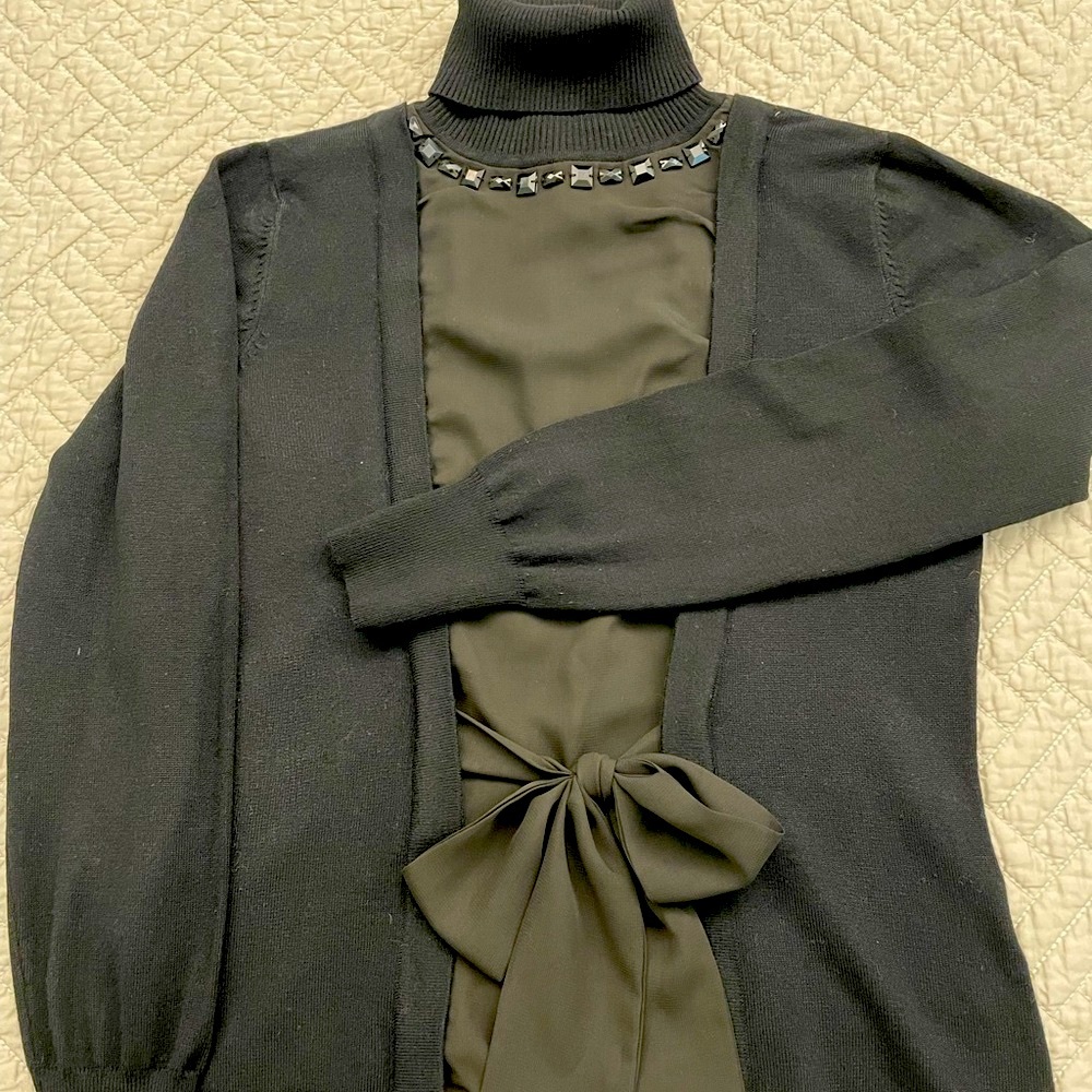 Women’s size S turtleneck sweater.